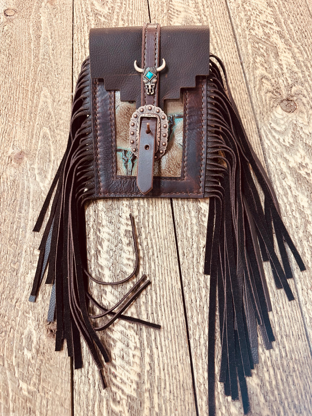 Back cinch saddle cell phone holder