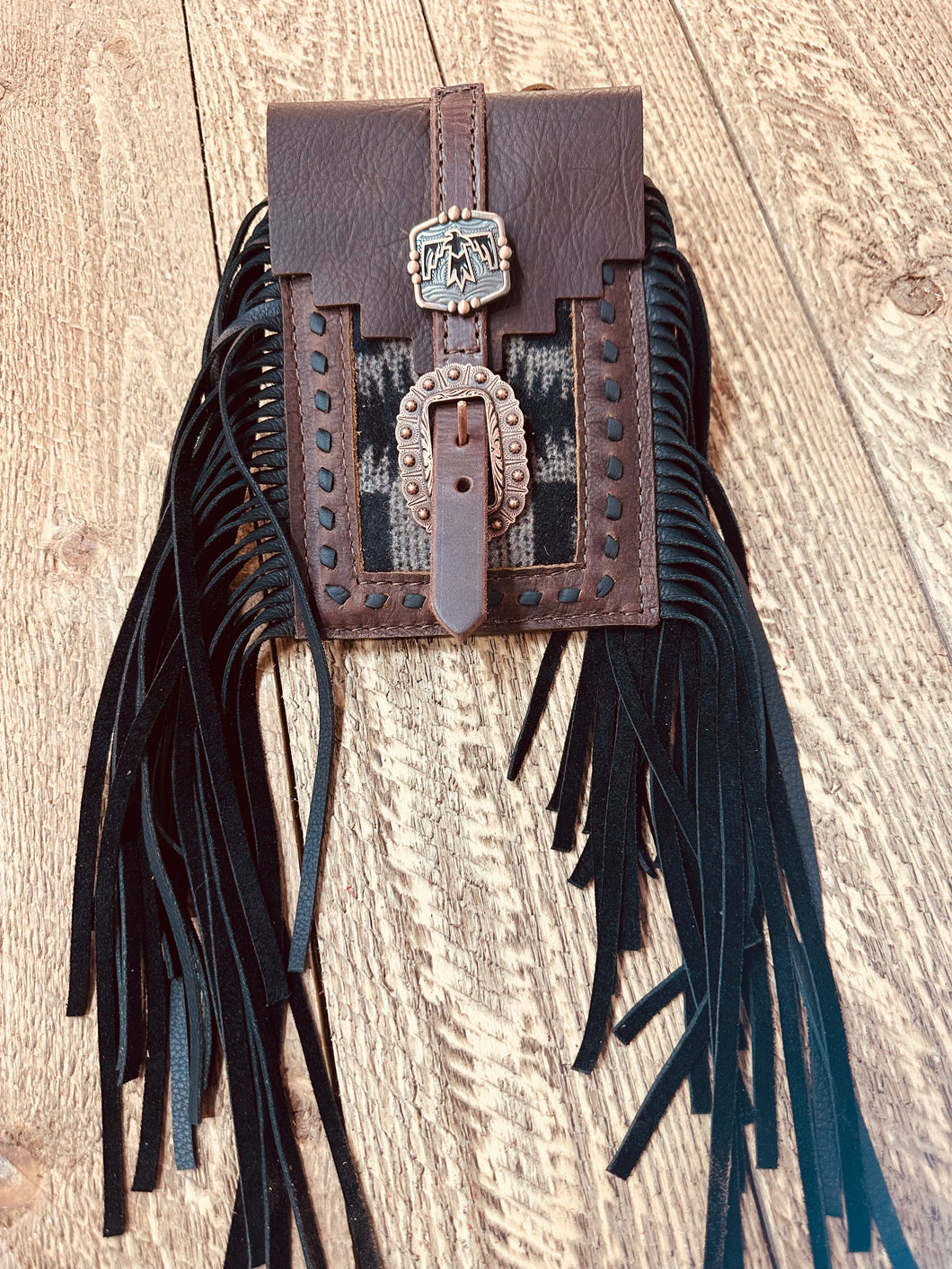 Back cinch saddle cell phone holder