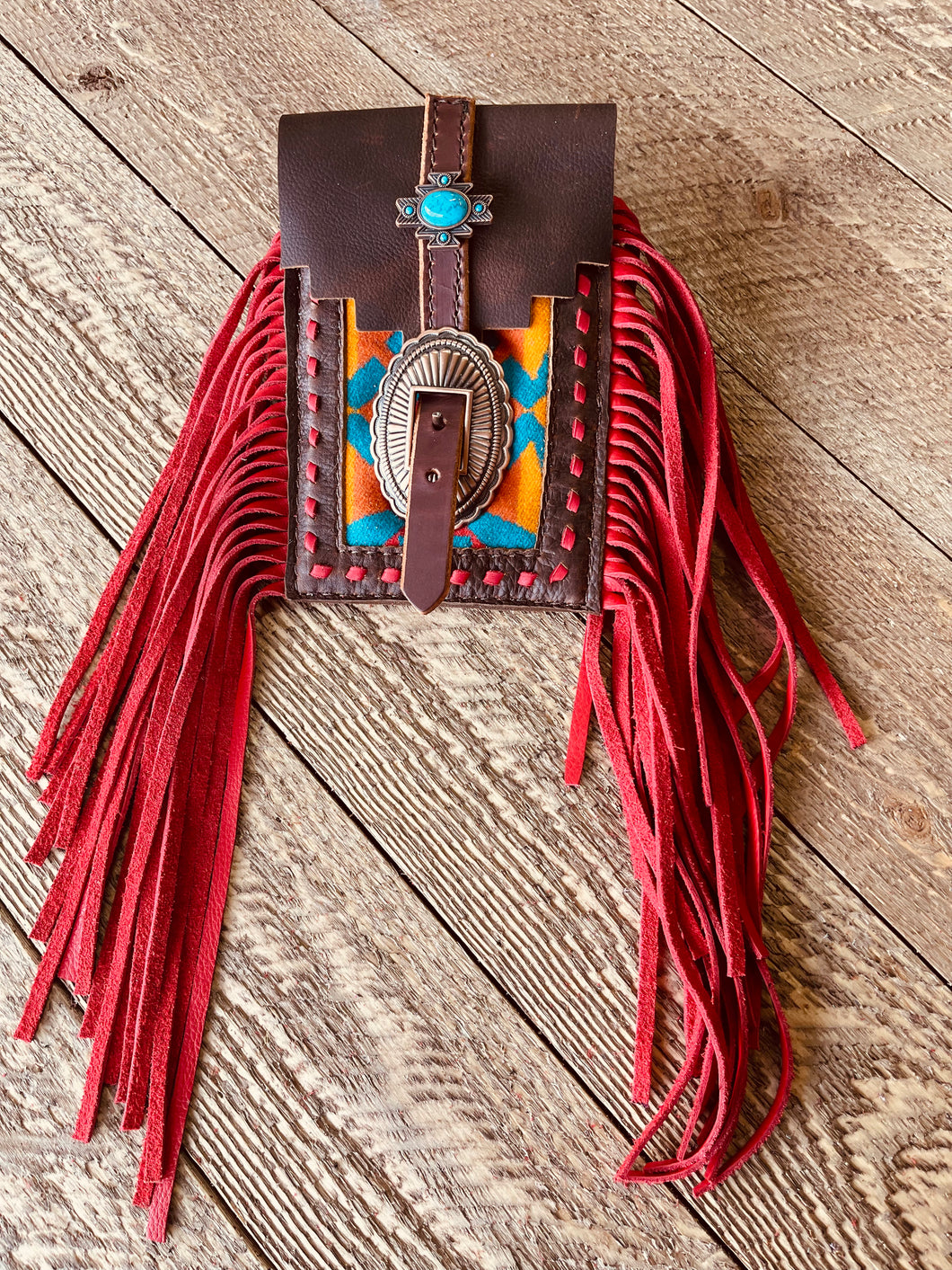 Back cinch saddle cell phone holder