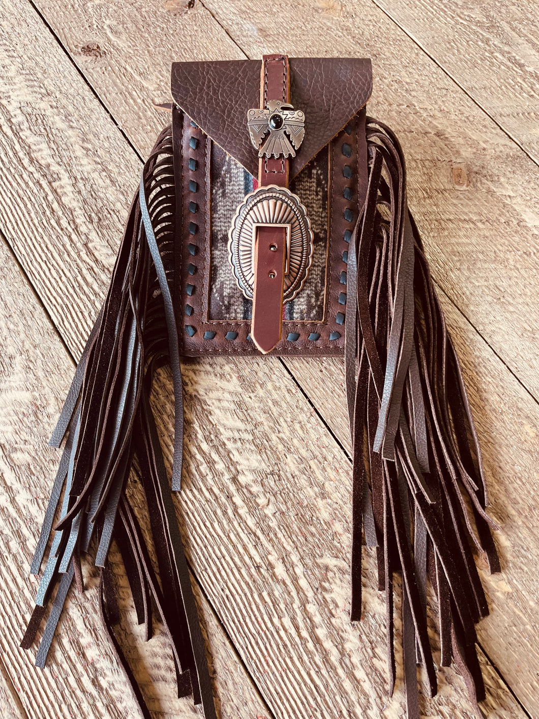 Back cinch saddle cell phone holder