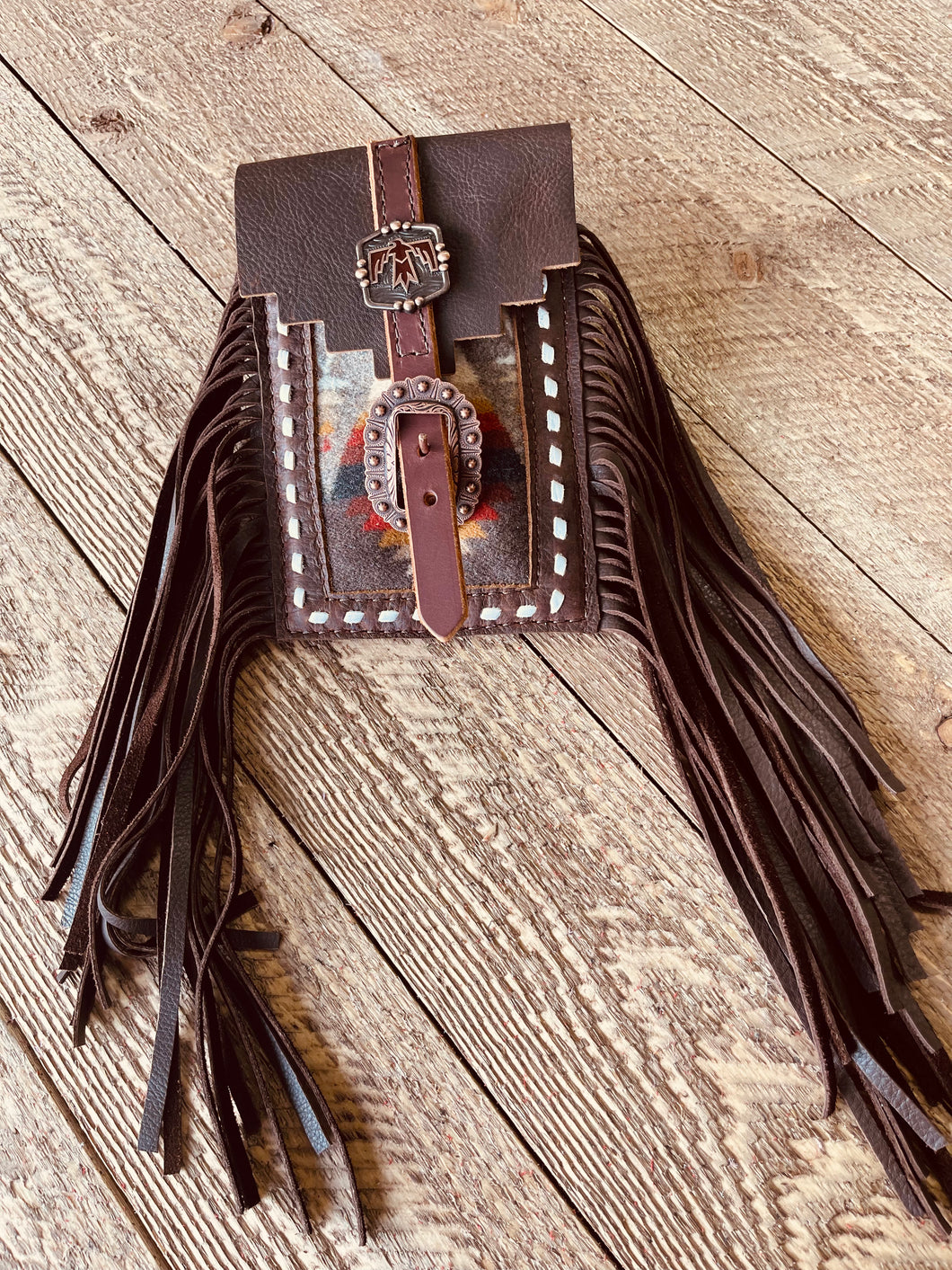 Back cinch saddle cell phone holder